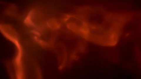 Close up slow motion footage of flames spreading across surfaces on a black.. Video stock 328163200
