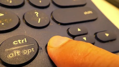 Close-Up Slow Motion Footage of Pressing Arrow Keys on a Bluetooth Keyboard Stock Footage 319513005