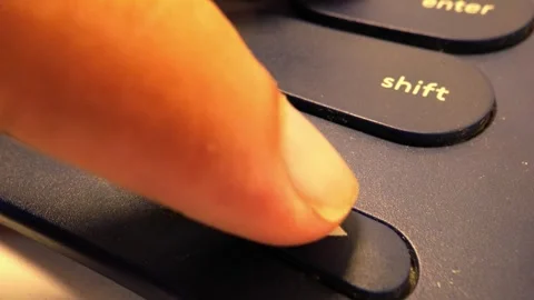 Close-Up Slow Motion Footage of Pressing Arrow Keys on a Bluetooth Keyboard Stock Footage 319513073
