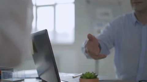 Close up slow motion footage of two business people shaking hands. Manager and Stock Footage 112757427
