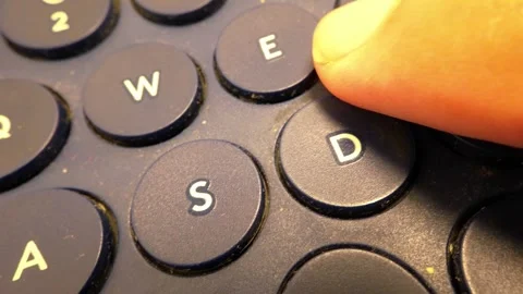 Close-Up Slow Motion Footage of Typing the Word 'Yes' on a Bluetooth Keyboard Stock Footage 319513065