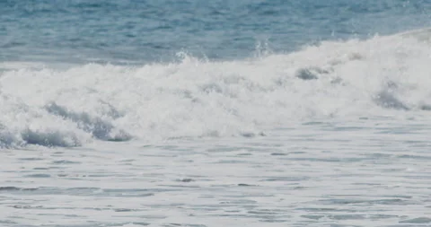 Close up of Slow Motion Footage of Waves Crashing on the Beach - Stock Video Stock Footage 239477903