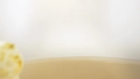 Close up slow motion of fresh popcorn dropping into bucket Stock Footage 105599693