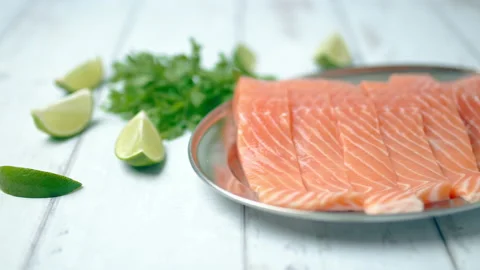 Close-up slow-motion of fresh raw red salmon. Video stock 132786117