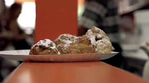Close up Slow Motion Fried Zeppole on counter Williamsburg Brooklyn Stock Footage 252330707