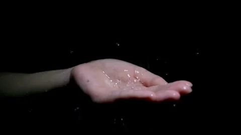 Close up slow motion Hand scooping with fresh water in black dark background. Stock Footage 270407183
