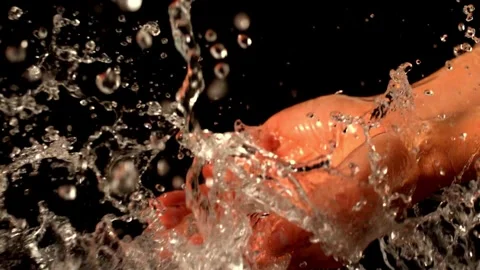 Close up slow motion Hand scooping fresh water in pure mountain spring Curren Stock Footage 270407552