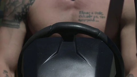 Close up in slow motion of hands on steering wheel of a ATV vehicle. Stockbeeldmateriaal 71242248