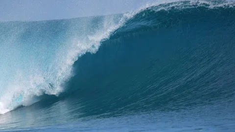 CLOSE UP, SLOW MOTION: Heavy blue wall of water rising at a Mentawai reef break Stock Footage 336339170