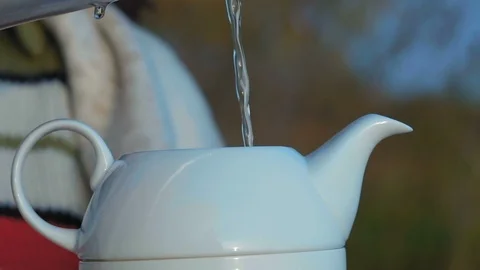 Close-Up, Slow Motion A Jet Of Boiling Water Pouring Into A White Porcelain Stock Footage 97849993