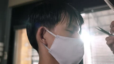Close up Slow motion Lens flare: Barber Shop Hair cut queueing Stock Footage 135551259