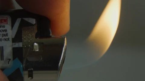 Close-up in slow motion of a lighter with flame Stock Footage 117626145