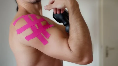 Close-up slow motion A man doing massage exercises. Using a percussion vibro Stock-Footage 302656065