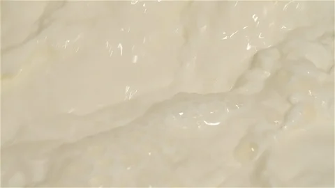Close-up Slow Motion of Mixing Milk in a Machine Stock Footage 128965748