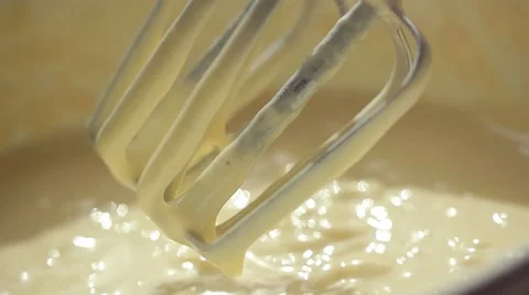 Close-up of slow motion mixing muffin mixture with electric mixer FullHD 1080p Stock Footage 66567798