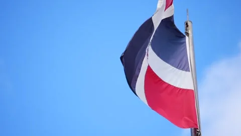 Close up slow motion of national flag of the Dominican Republic waving in the Stock Footage 240857359