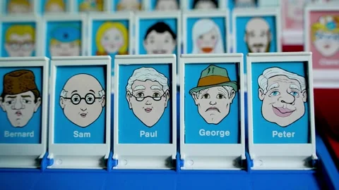 Close-Up Slow Motion Pan of Classic “Guess Who?” Board Game Faces 動画素材 313433196