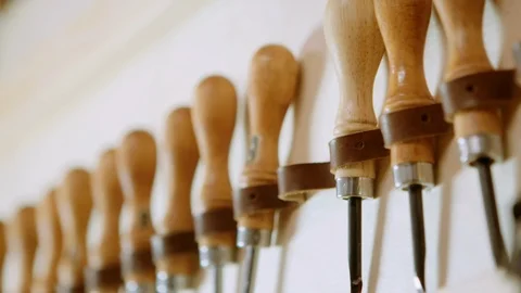 Close up slow motion pan of leather bevel tools Stock-Footage 96133402