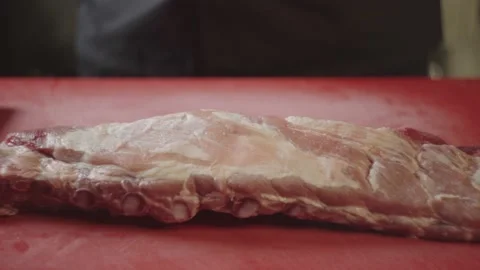 Close up slow motion of pork ribs falling on the table. Stock Footage 233614680