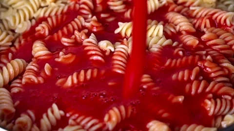 Close-Up Slow Motion Pouring Tomato Sauce on Pasta. Stock Footage 275593144