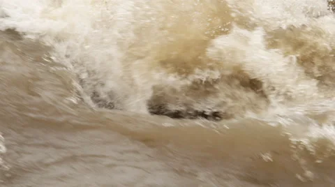 Close-up slow-motion rapids on a muddy river in flood Stock Footage 59208285