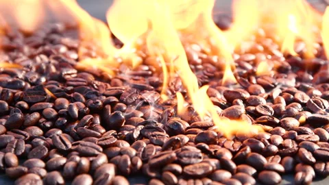 Close-up slow motion roasting coffee beans or seeds background with fire flame Stock Footage 306522626