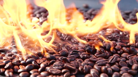 Close-up slow motion roasting coffee beans or seeds background with fire flame Stock Footage 306999341
