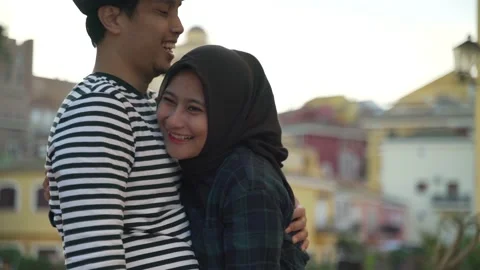 Close up slow motion of romantic Asian couple with the colorful house  Stock Footage 140304063