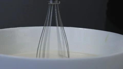 Close-up, Slow Motion, Rotating Mixer Removed from the Bowl Stock Footage 106261999
