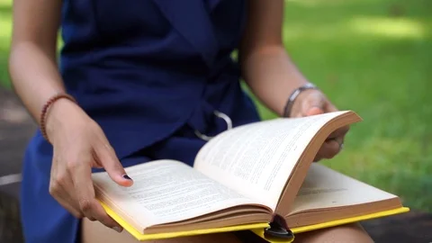 Close up slow motion scene of Asian women students are reading diary books or Stock Footage 119245692