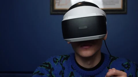 Close up Slow motion scene video of a caucasian man using a VR headset helmet Stock Footage 144630152