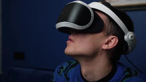 Close up Slow motion scene video of a caucasian man using a VR headset helmet Stock Footage 144631055