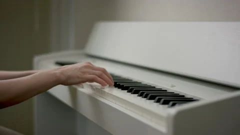 A close up slow motion scene of a young woman sitting at the beautiful white Stock Footage 132289573