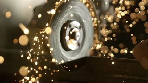 Close-up slow motion shot of angle grinder cutting metal with sparks flying. Stock Footage 337546404