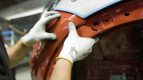 Close up slow motion shot of assembling a car body. Automotive industry Stock Footage 116710933