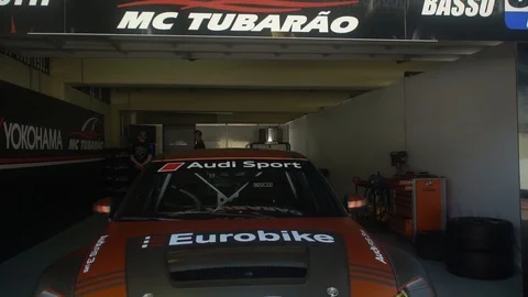 Close up, slow motion of shot of an Audi sports car, in the workshop, at Stock Footage 98357378