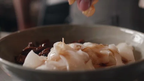 Close up slow motion shot of Chef decorating thai food Stock Footage 91085894