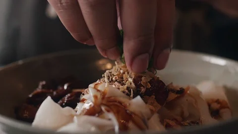 Close up slow motion shot of Chef decorating thai food Stock Footage 91086059