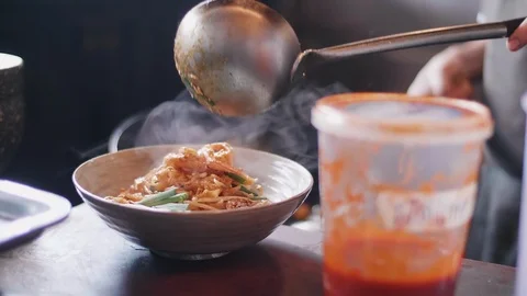 Close up slow motion shot of Chef decorating thai food Stock Footage 91087244