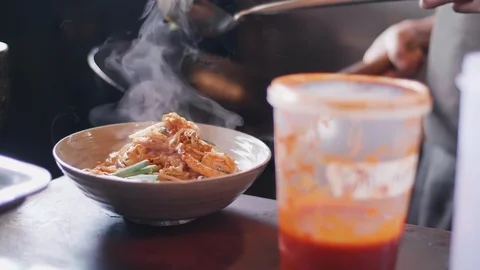 Close up slow motion shot of Chef decorating thai food Stock Footage 91087386