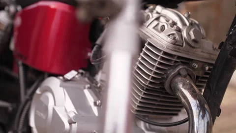 Close-up slow motion shot. Details of motorcycle at sunset on the street Stock Footage 152865780