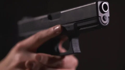 Close-Up Slow Motion Shot of Hand Holding a Pistol With Propper Trigger 스톡 동영상 119225779