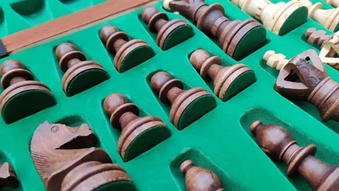 Close up slow motion shot of handmade / handcrafted wooden Chess pieces neatl Stock Footage 130978317