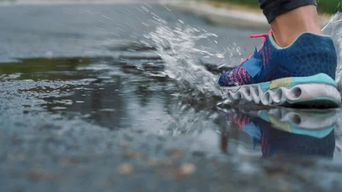 Close up slow motion shot of legs of a runner in sneakers. Female sports man Stock Footage 90717992