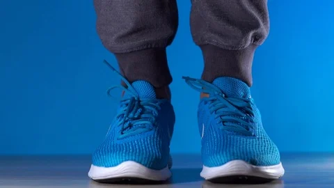 Close up slow motion shot of legs. Composition with sport shoes cropped shot of Stock Footage 101822187