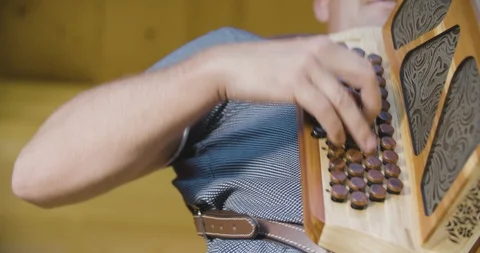 Close up slow motion shot man playing on accordion, musician hands. Stock Footage 117068010