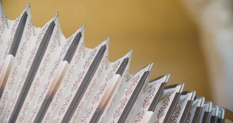 Close up slow motion shot man playing on accordion, musician hands. Stock Footage 117068312