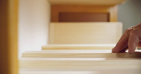 Close up slow motion shot, mans hand touches small wooden piece, scrap, fragment Stock Footage 117065269