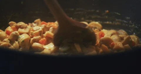 Close up slow motion shot, mixing vegetables in a cooking pan. Stock Footage 120249398