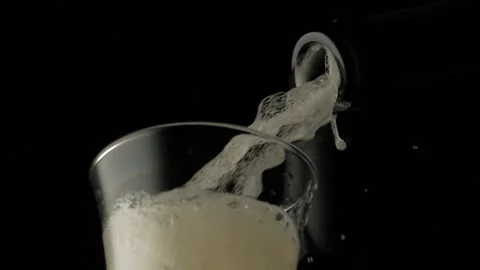 Close-up, slow motion shot: Pouring champagne into a glass on a black background 스톡 동영상 149836647